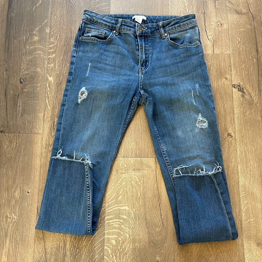 Women’s H&M ripped jeans.